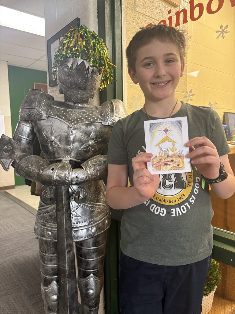 Sebastian Woods with his winning Christmas card design.