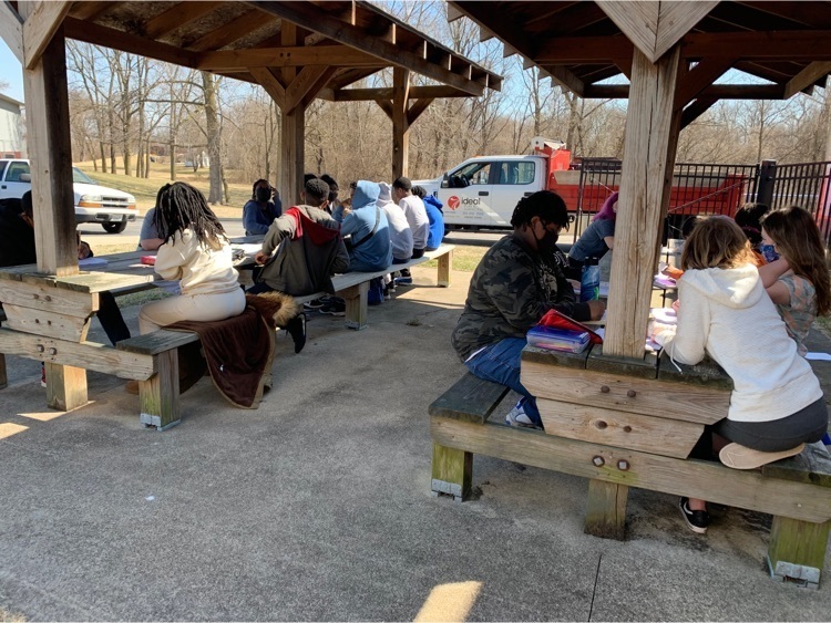 8th grade Pre-Algebra taking advantage of the beautiful weather and working on homework outside.