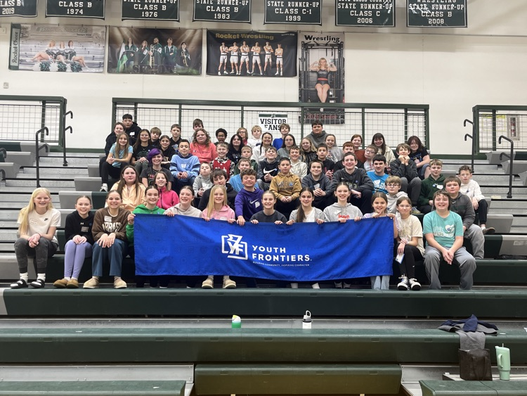 7th graders posing with the youth frontier banner