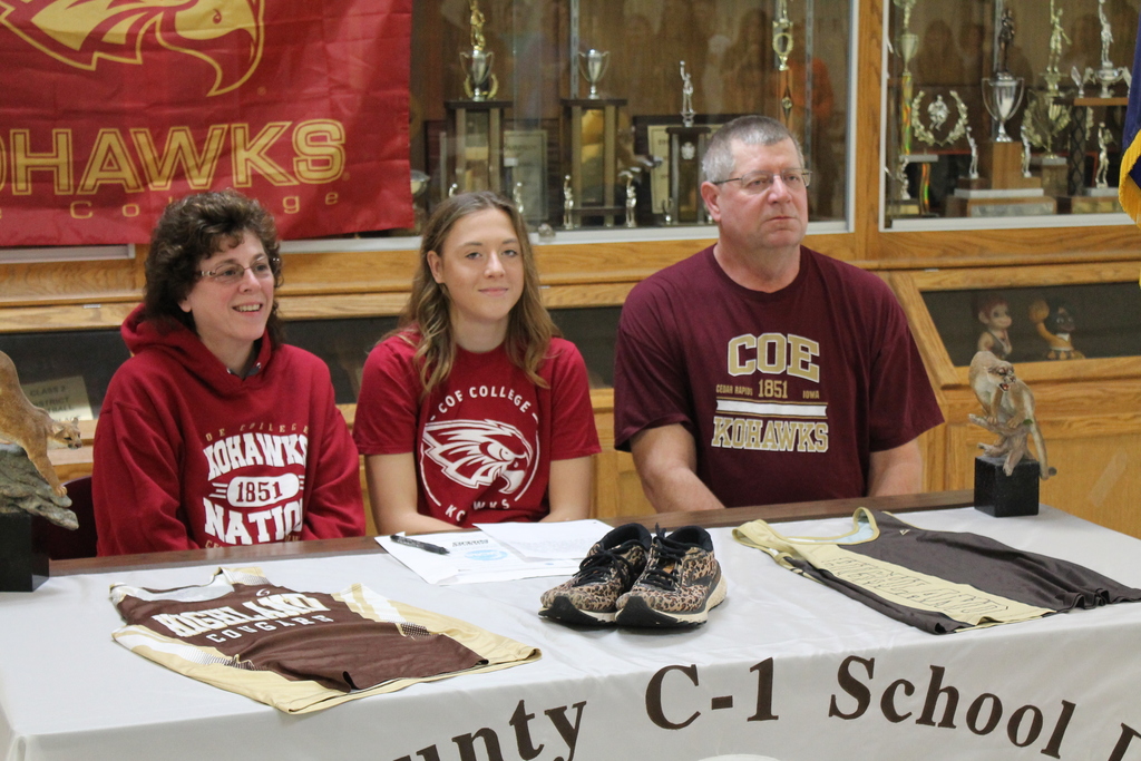 Alexis Vaughn college signing with COE College to run Cross Country and Track. Pictured here with mom (Gail Vaughn) and dad (David Vaughn).