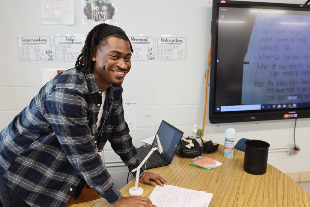 Teacher smiling at camera