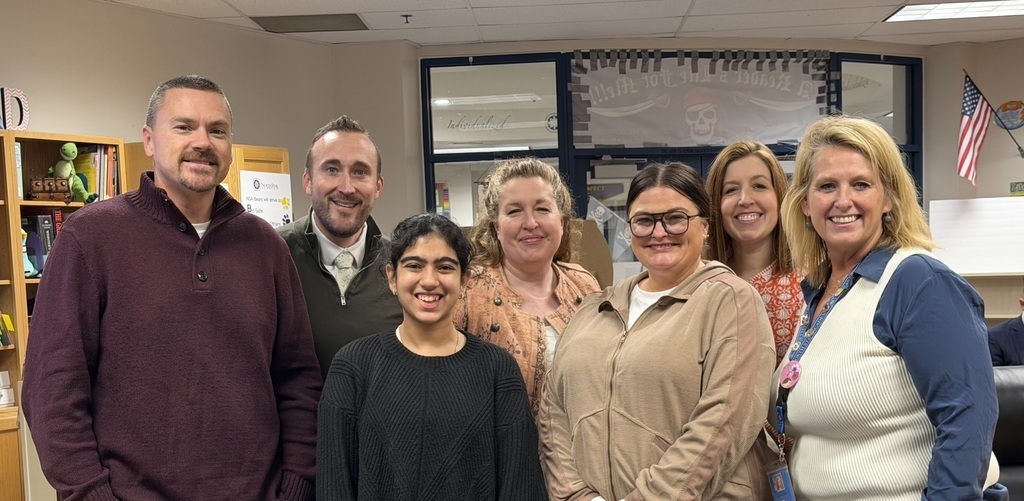 a photo of the NSA board of trustees with 2 spelling bee finalists