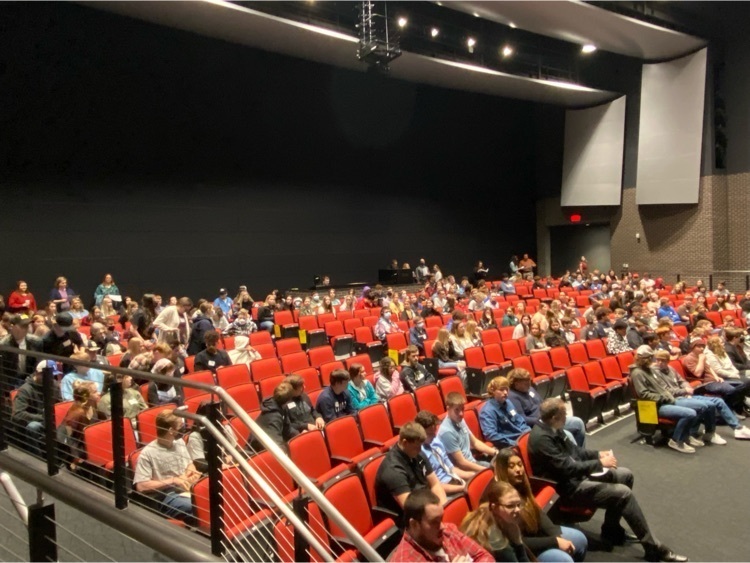 students listening to speakers 