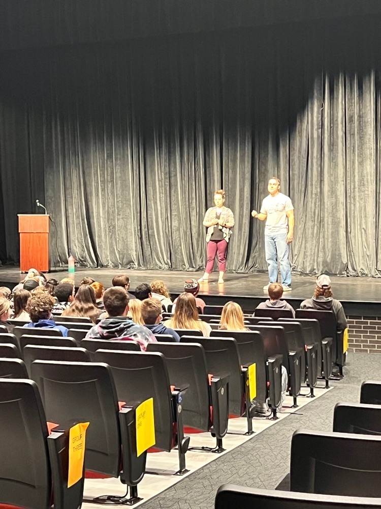 students listening to a speaker 