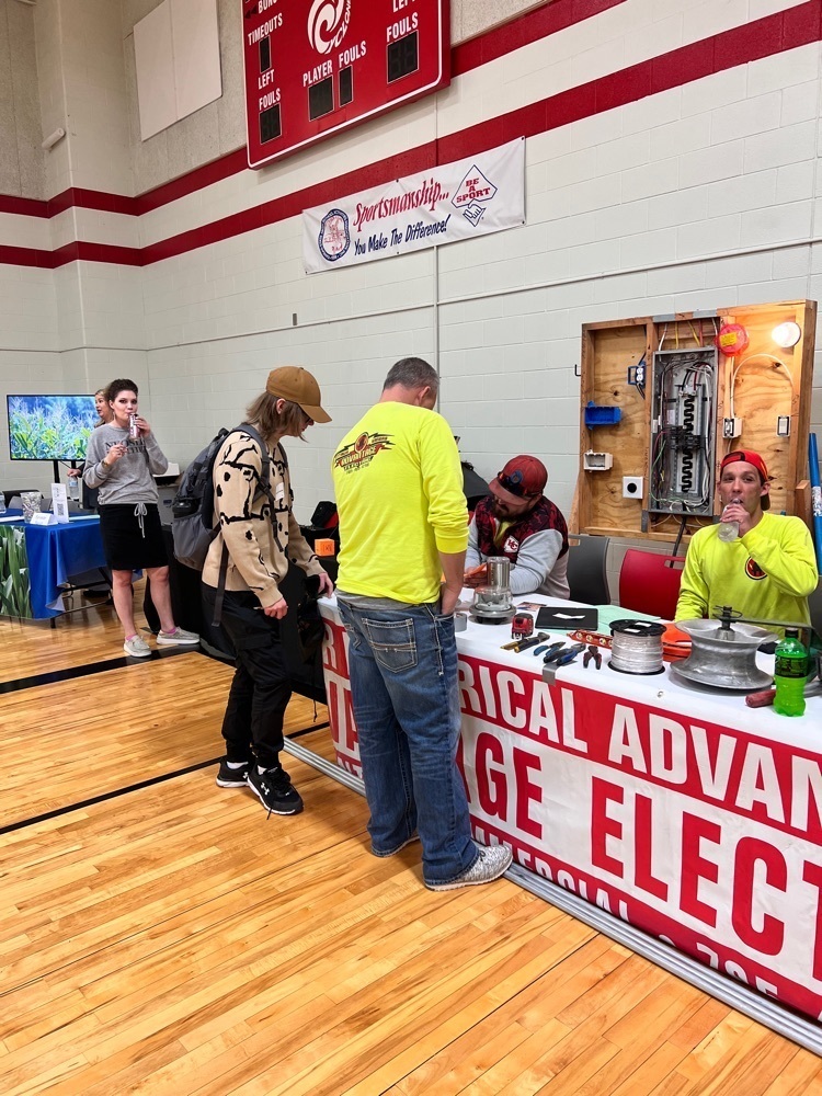 students at a booth 