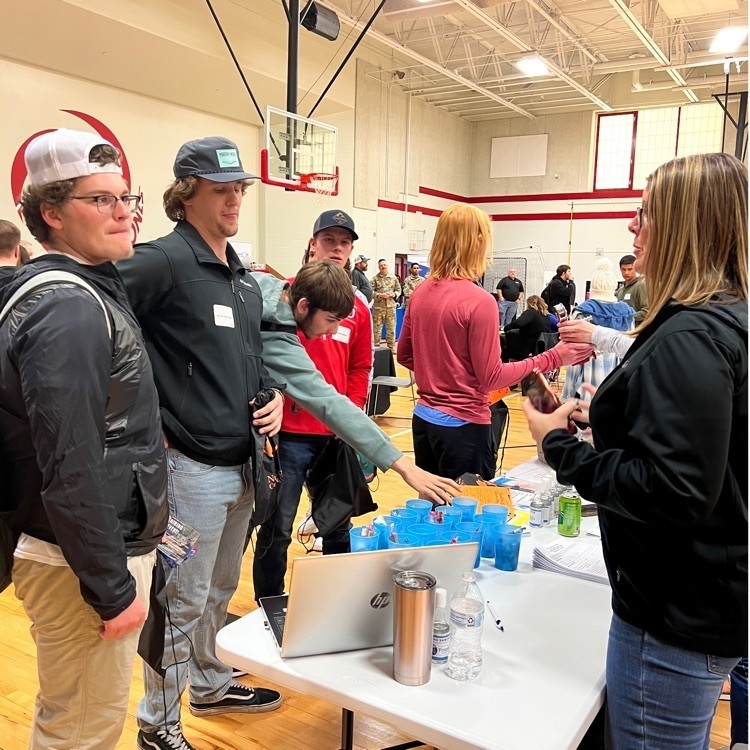 students at a booth 