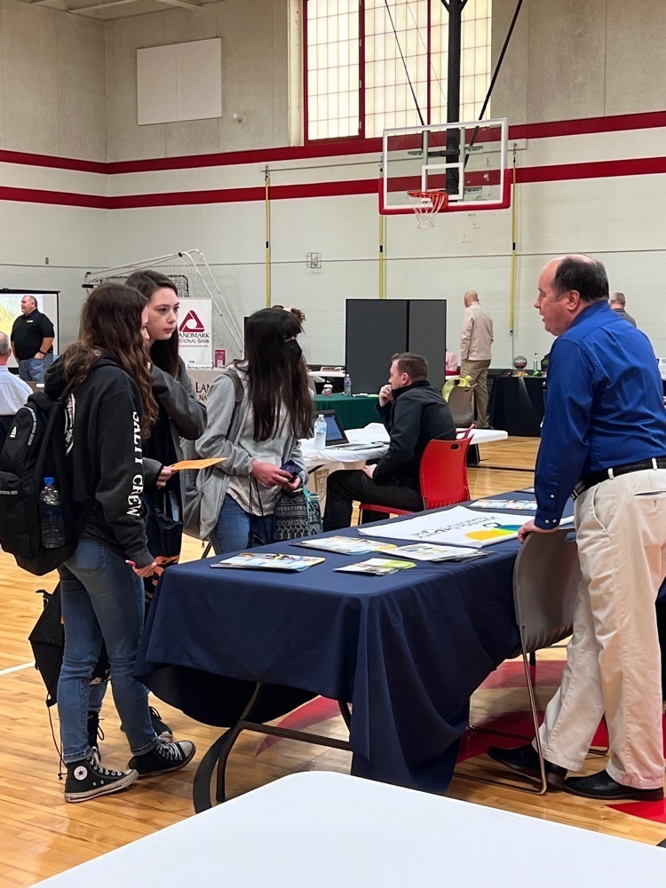 students at a booth 