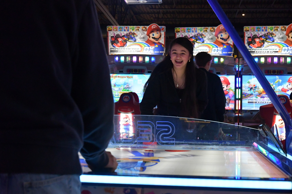 girl winning at air hockey