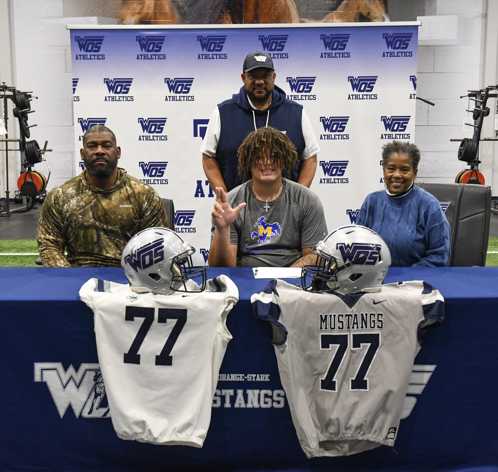 Coach Hickman, Principal McGrew, and Superintendent Alicia Sigee with Jadyn Rhodes