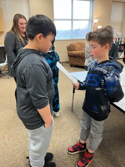 Students working together on an editing activity.