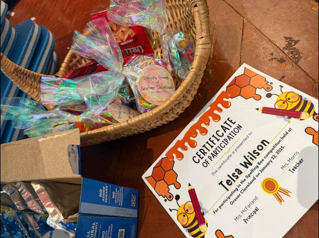 a basket with snaks and a certificate of participation.