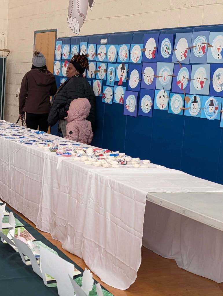 Art on tables and walls in a school.