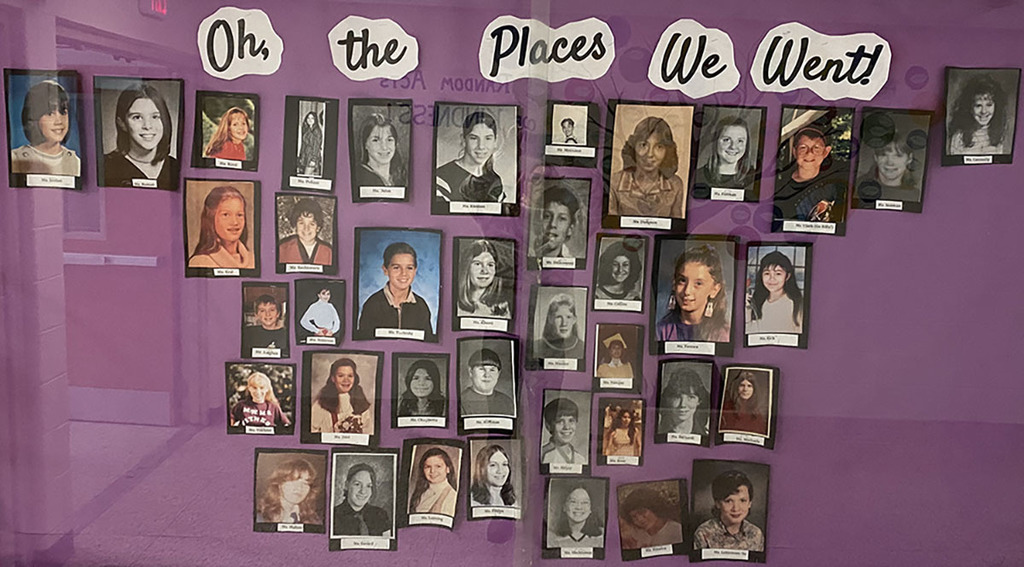 bulletin board of staff school photos