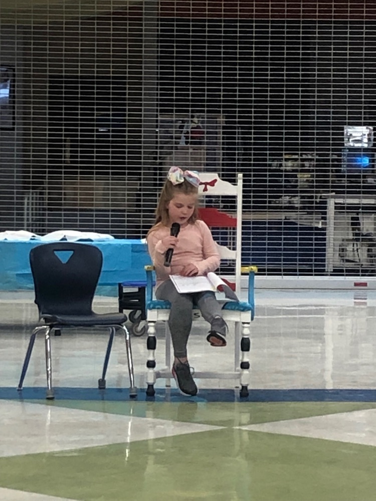 student reading their piece
