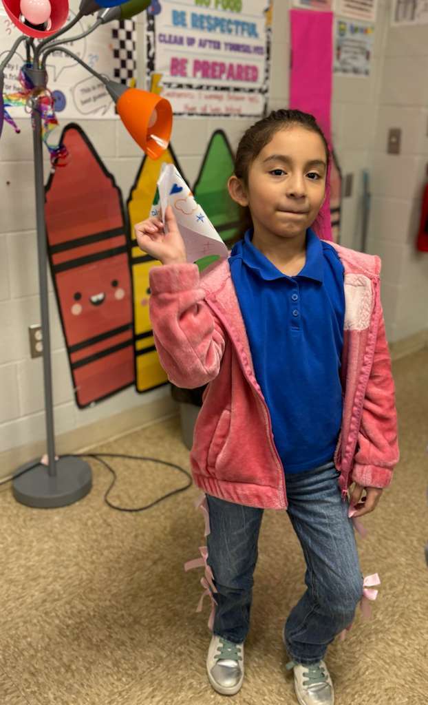 Students flying unique paper kites