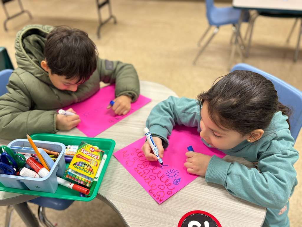 Students creating unique paper kites