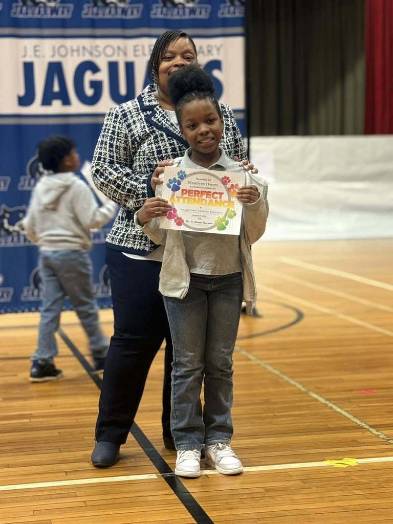 Student holding award diploma