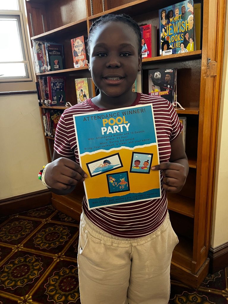 A young girl holding a Pool Party flyer.