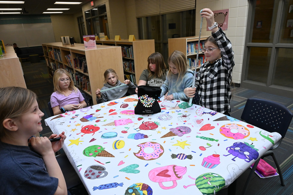 3rd grade girls doing crafts.