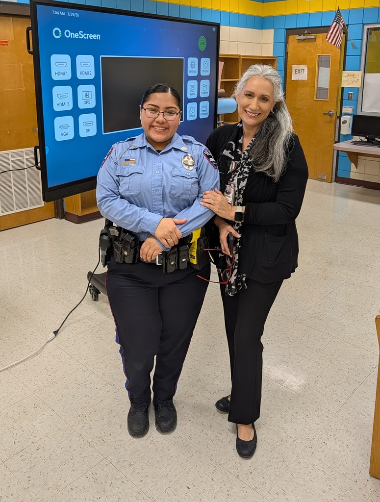 Police officer posing with staff member