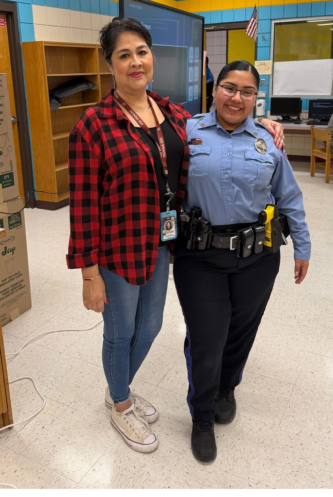 Police officer posing with staff member