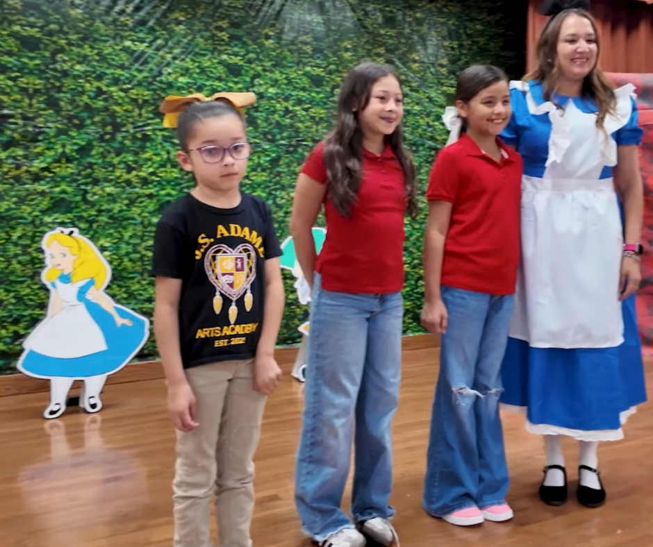 Ms. Garate and the three students that will be playing Alice roll. 