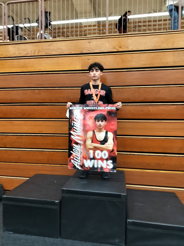 Student holds up banner. 