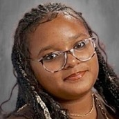 Photo of a young girl with glasses. 