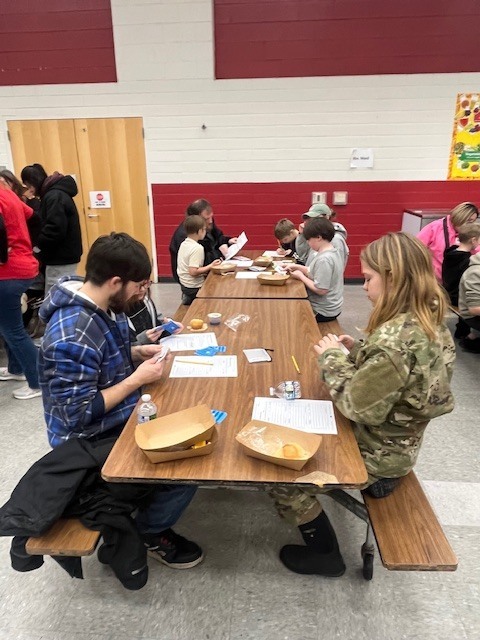 Students learning during breakfast with the teacher 9