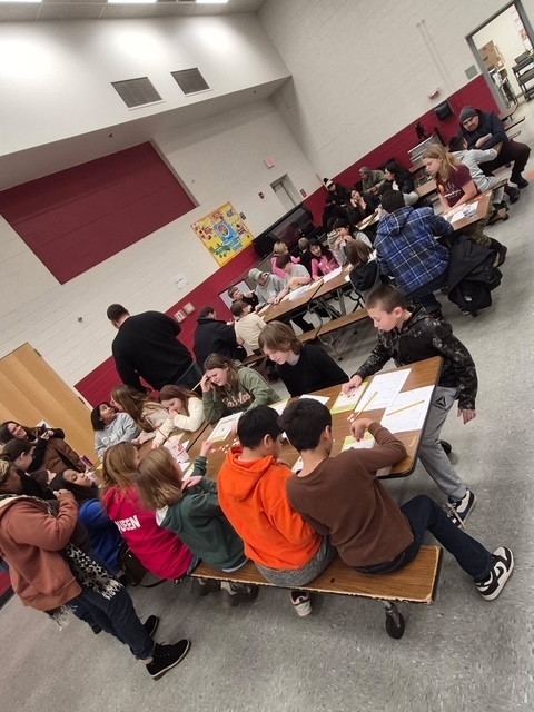 Students learning during breakfast with the teacher 6