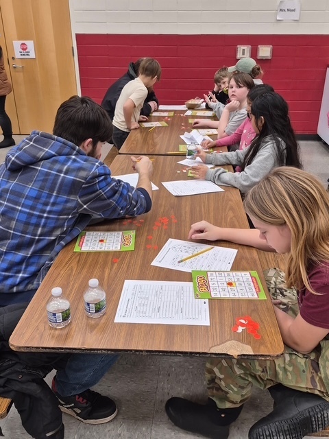 Students learning during breakfast with the teacher 8