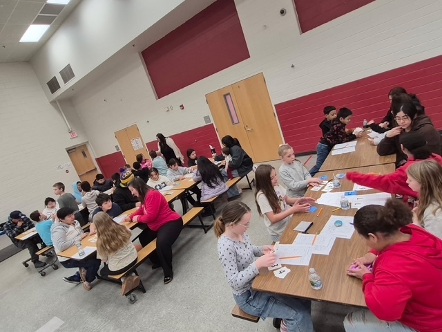 Students learning during breakfast with the teacher 5