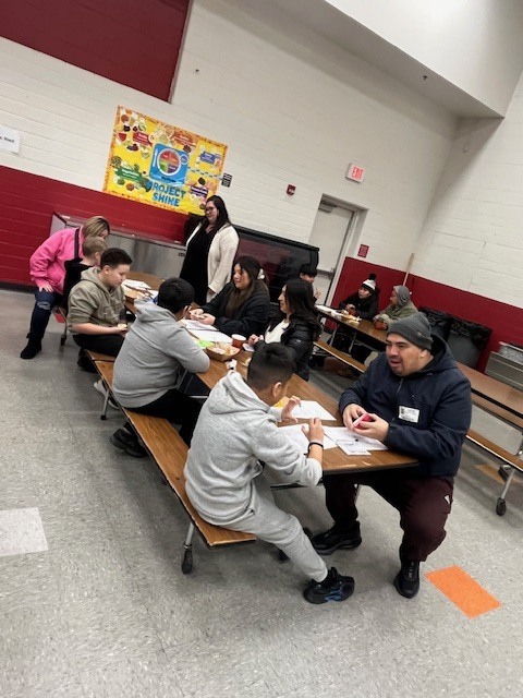 Students learning during breakfast with the teacher 2.