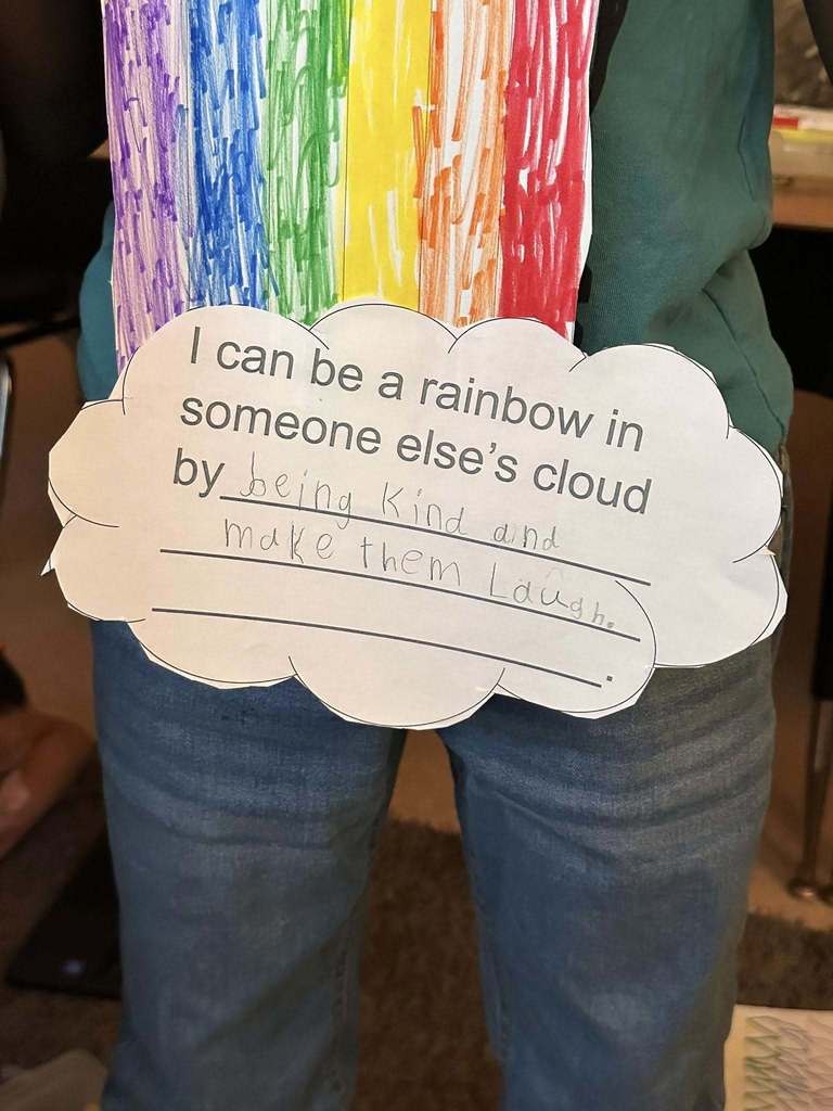 A paper cloud that says how a student can be a rainbow in someone else's cloud.
