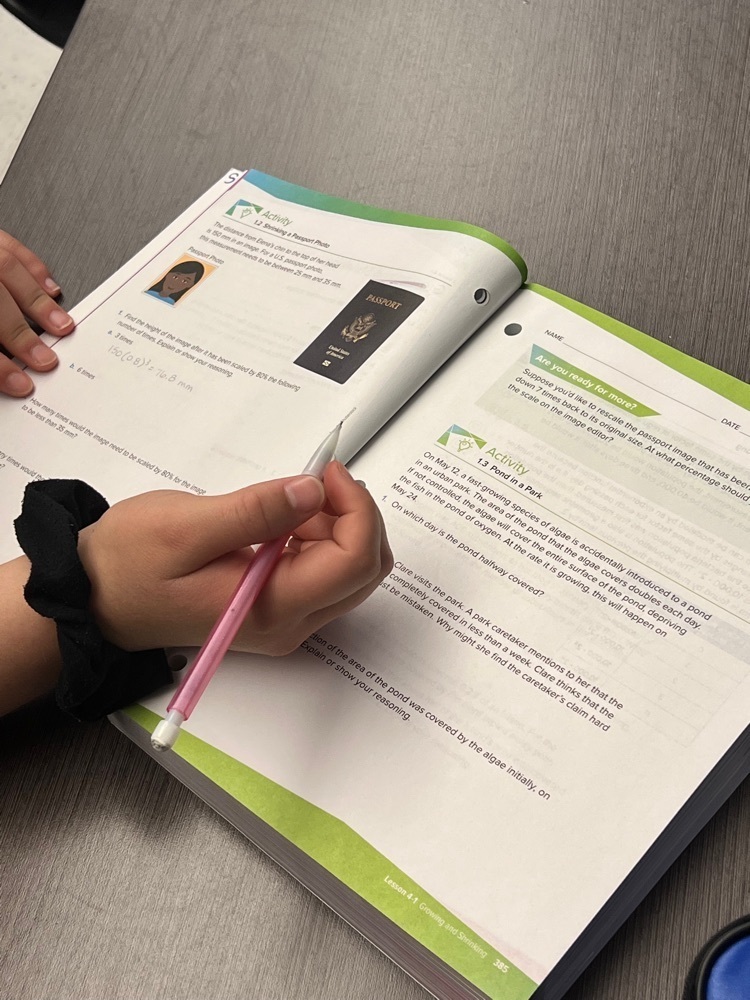 student writing in a workbook 