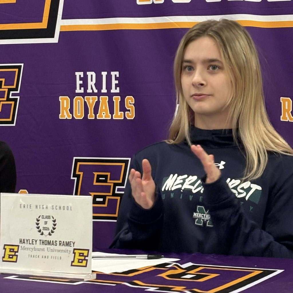 A young girl clapping.