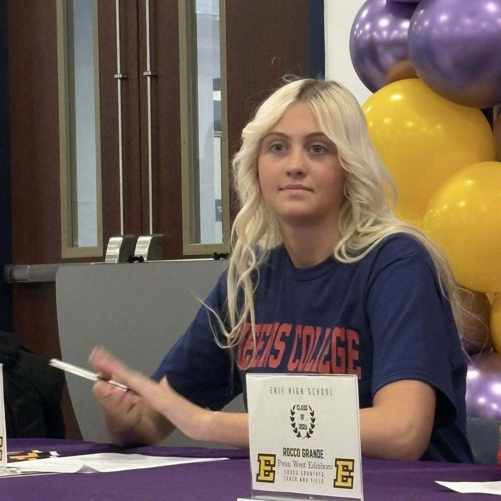 A young girl clapping.