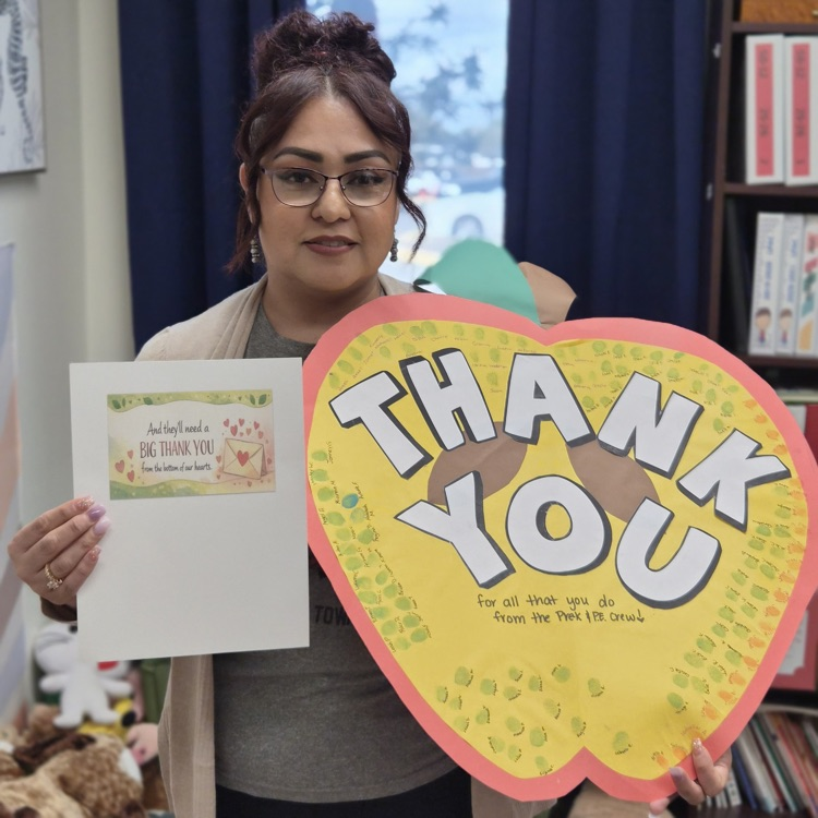 counselor with a heart with students fingerprints 