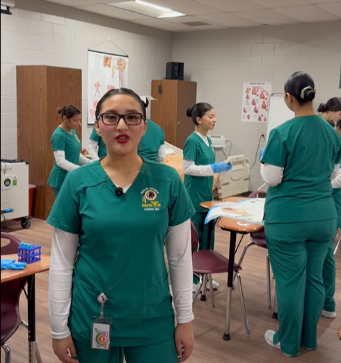 student with blue scrubs