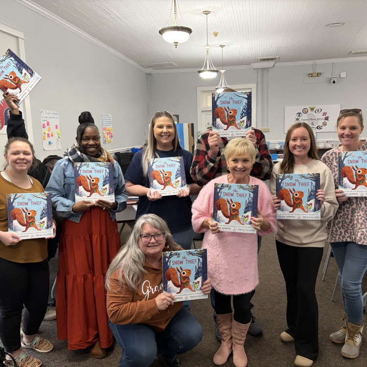 teachers holding book