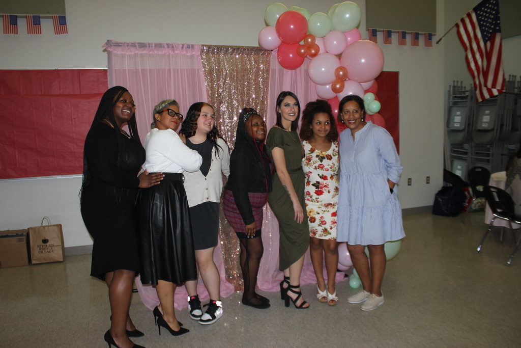 students and staff taking a picture