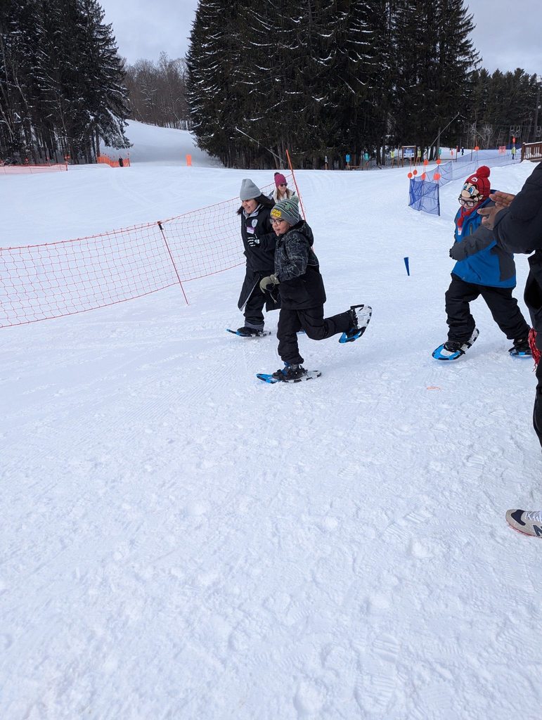 Kids playing in the snow. 