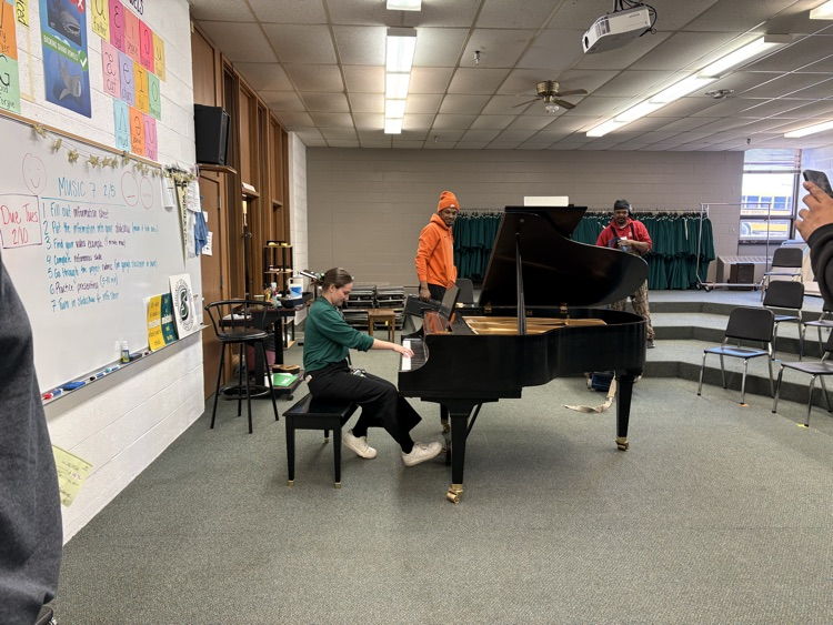 Ms. Chavanu playing the grand piano