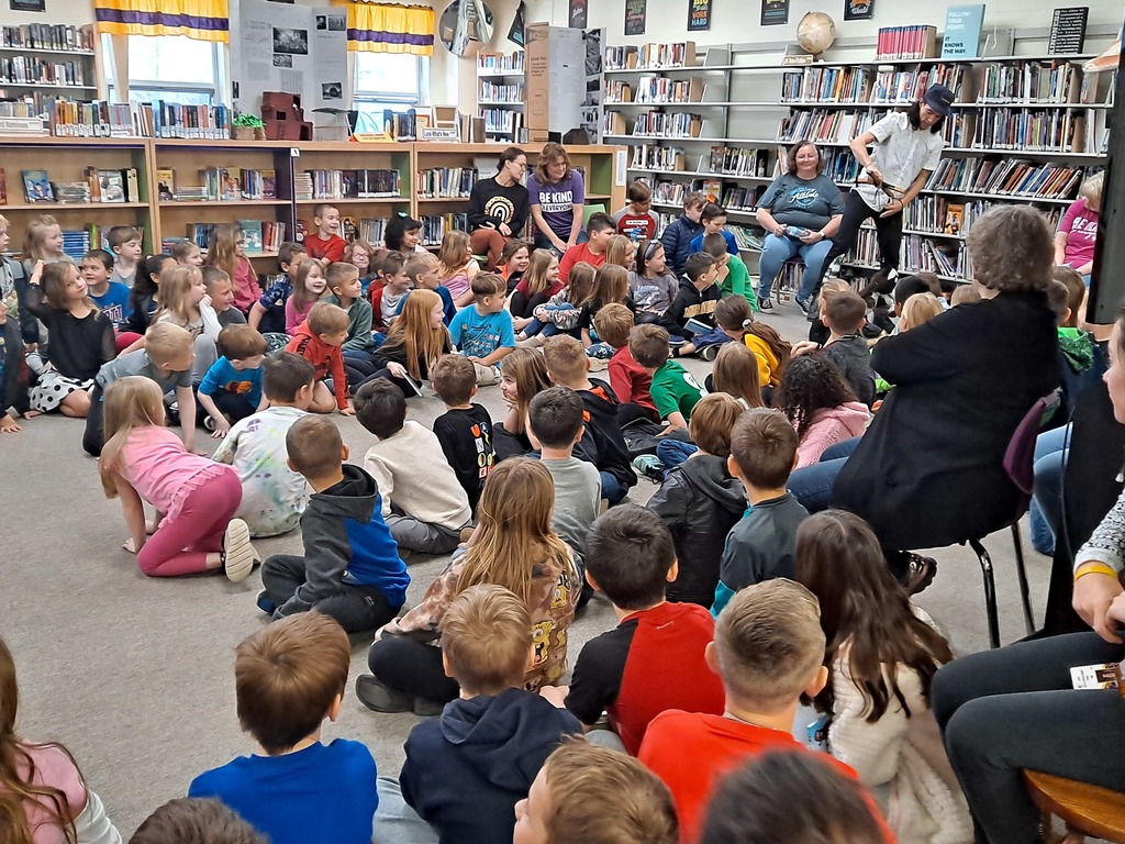 Students watching puppet