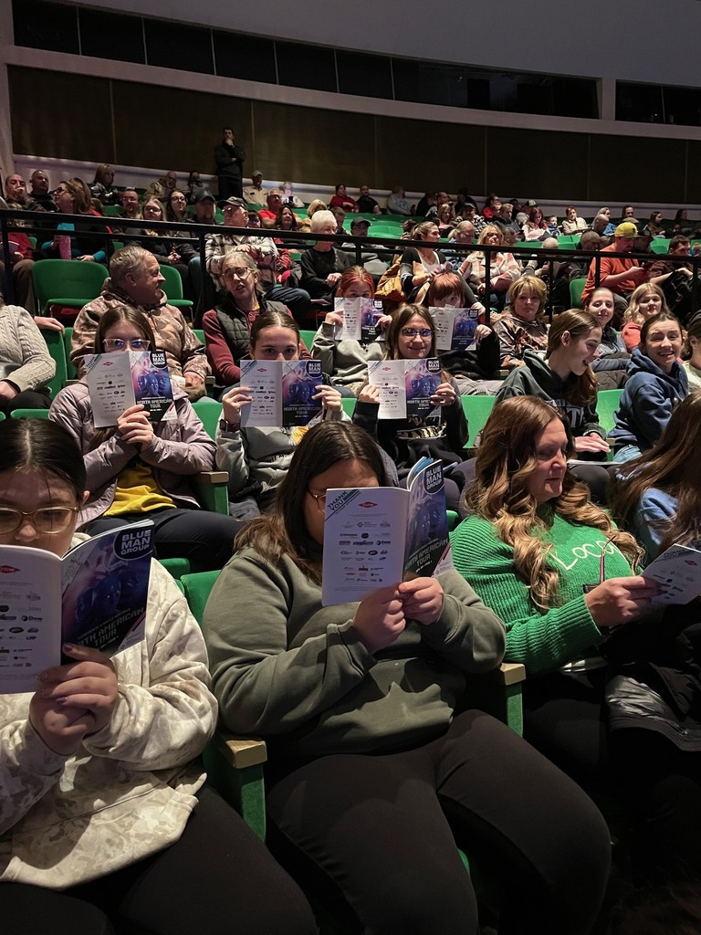 students seated at the performance