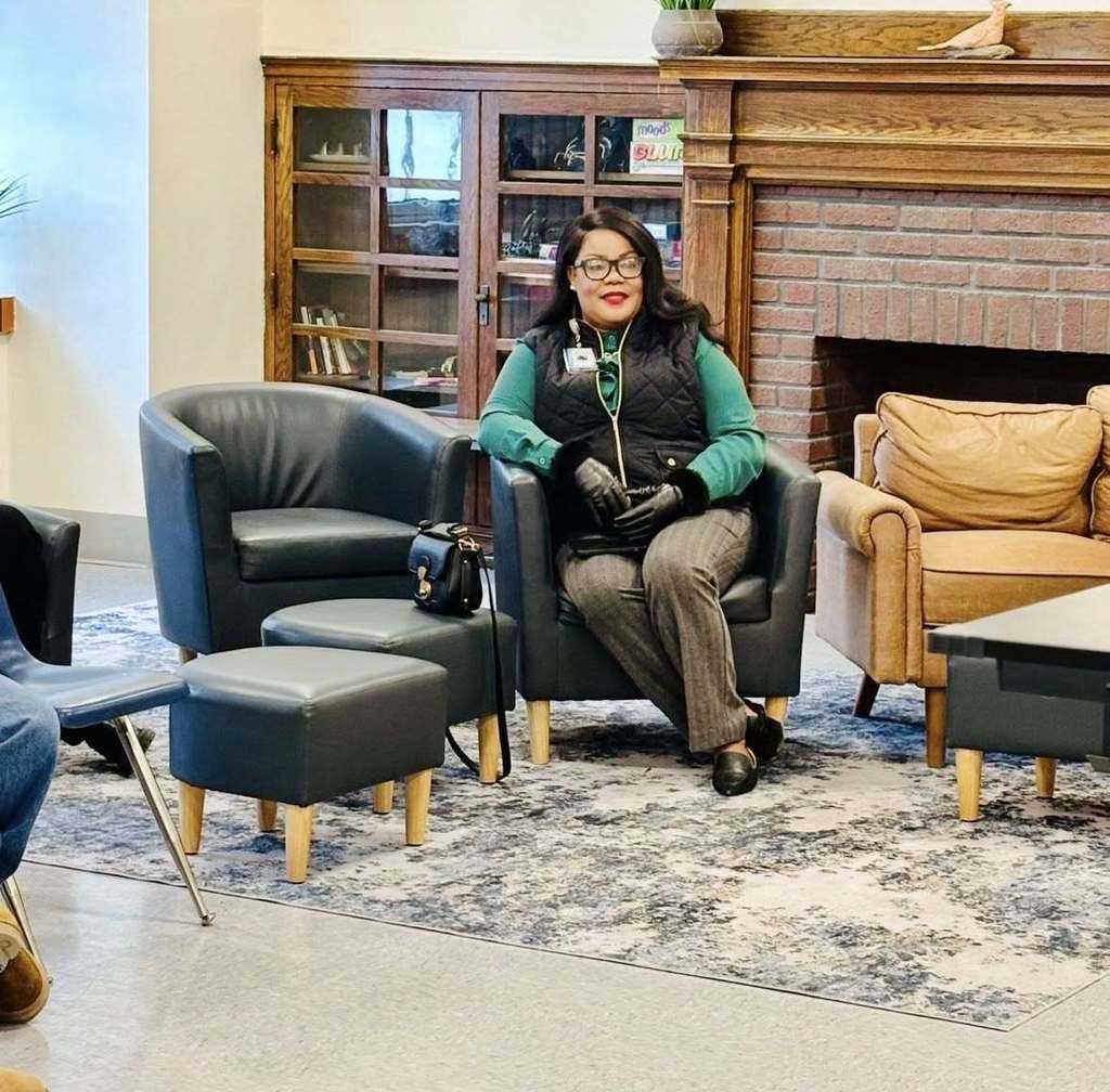 Women sitting in a chair.