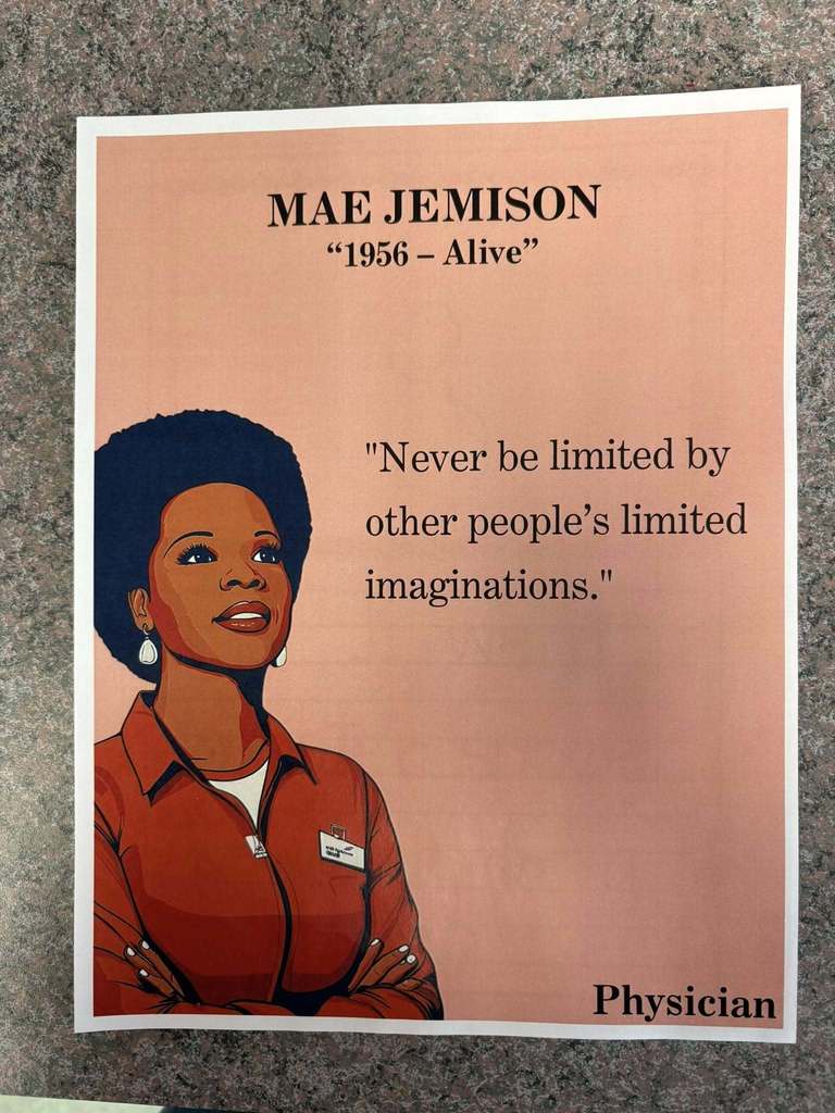 A paper about Mae Jemison and a photo of her on it.