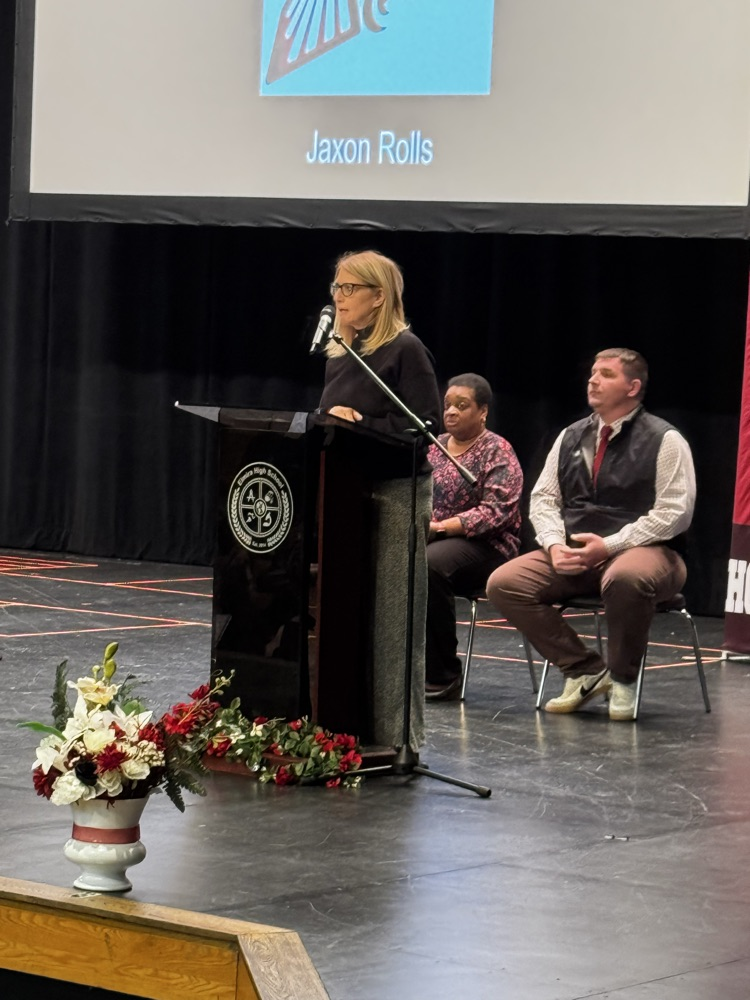 Mrs. Austin recognizing students who have committed to serve in our military  