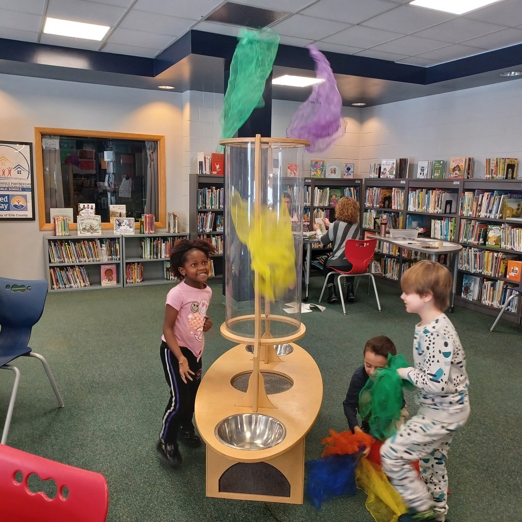 Kids playing in a library.