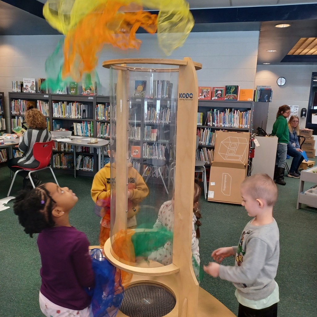 Kids playing in a library.